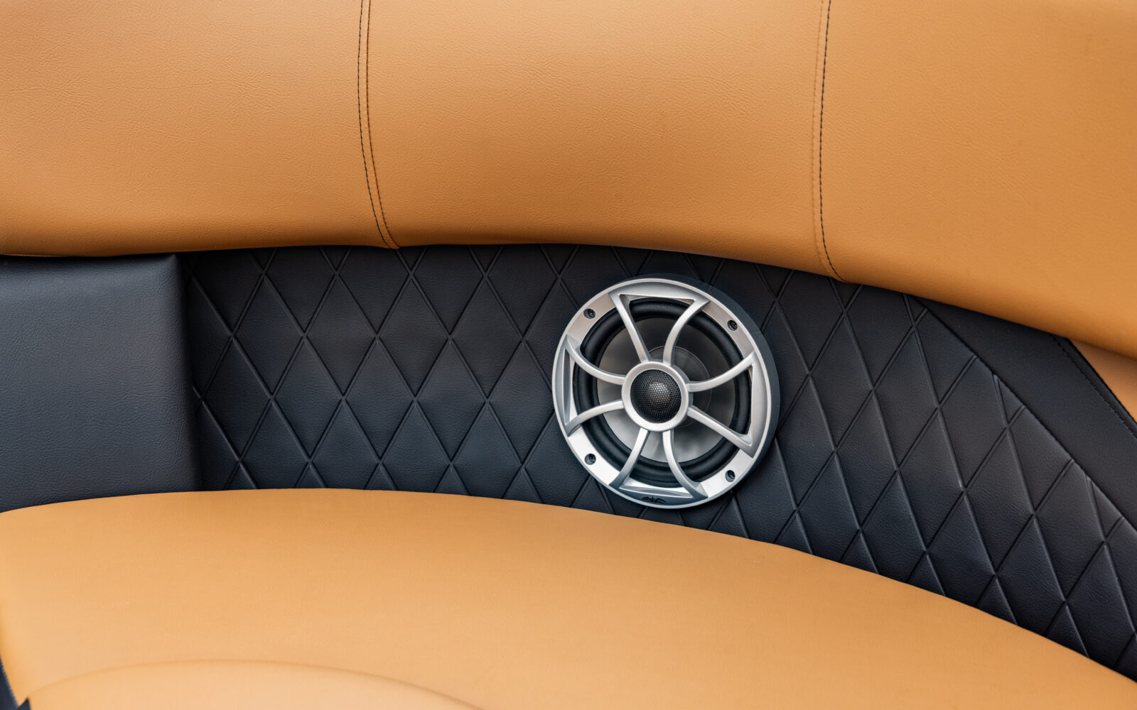 Premium Wet Sounds marine speaker integrated into Premier Sunscape pontoon seating.