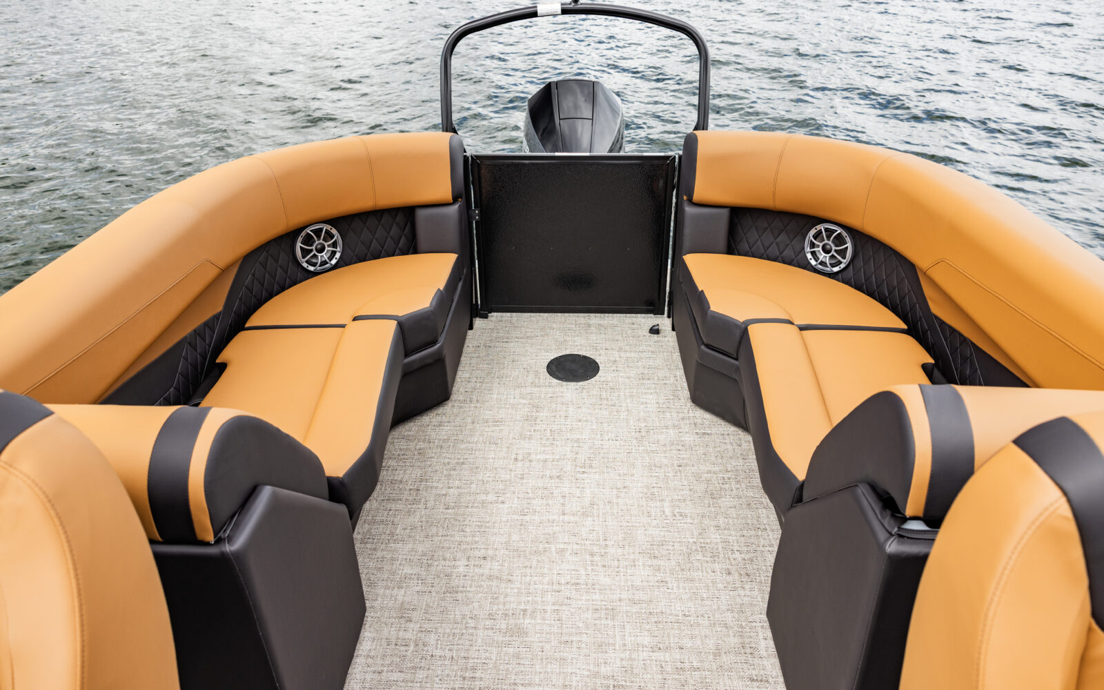 Premier Sunscape pontoon rear couch seating with premium upholstery and integrated speakers.